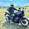 Sitting on a Harley Davidson Pan America at the RevZilla GET ON! Adventure Fest rally in Sturgis, SD.