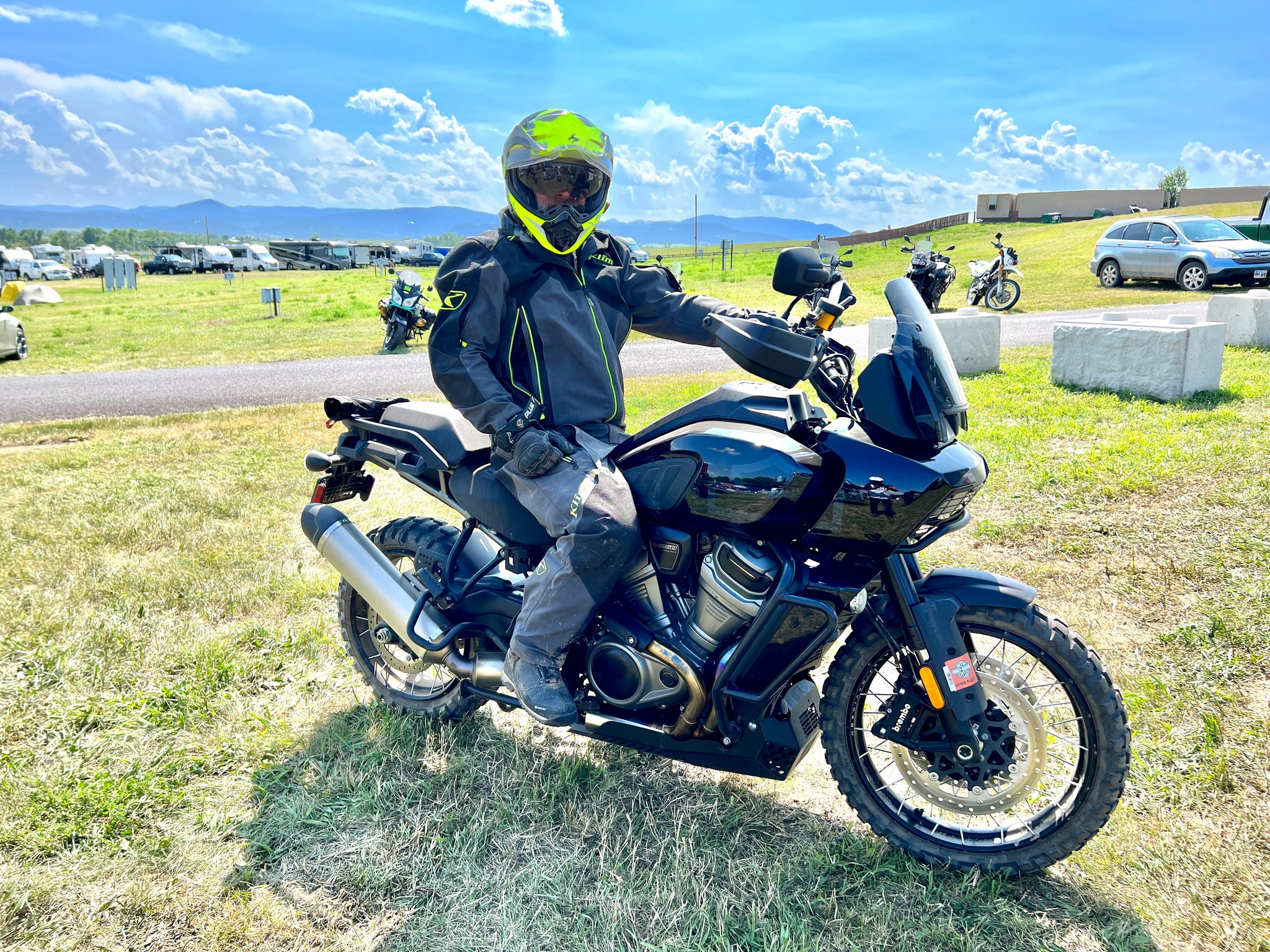 Sitting on a Harley Davidson Pan America at the RevZilla GET ON! Adventure Fest rally in Sturgis, SD.