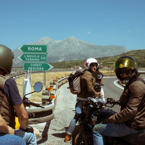 motorcyclists stop a fork in the road near Abruzzo outside of Rome.