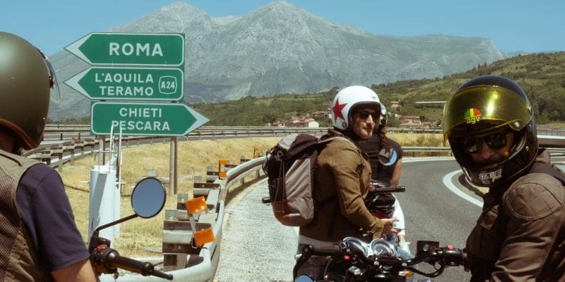 motorcyclists stop a fork in the road near Abruzzo outside of Rome.