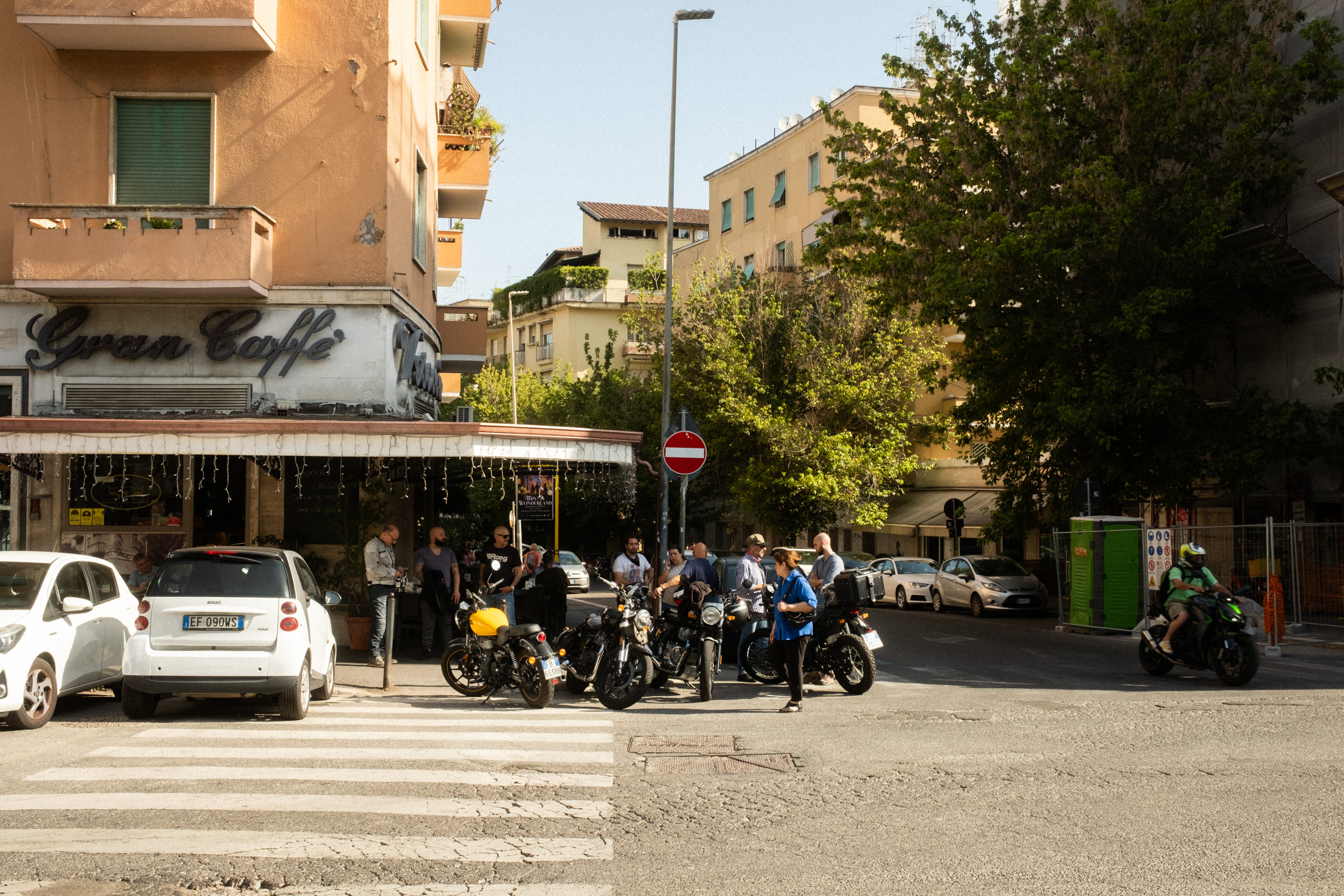 Motorcyclists stop at a small Rome caffe for an express before a sunday ride
