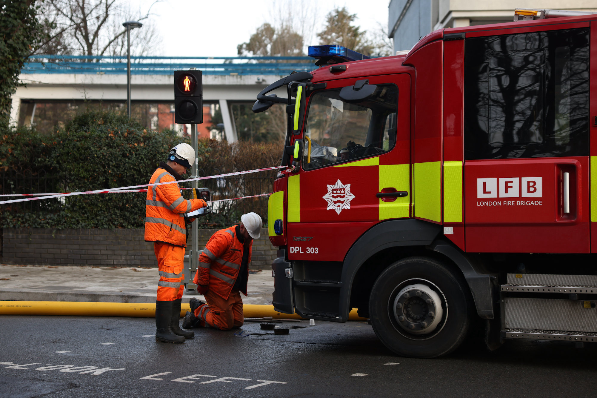Two firefighters working out particulars of an incident. Media sourced from