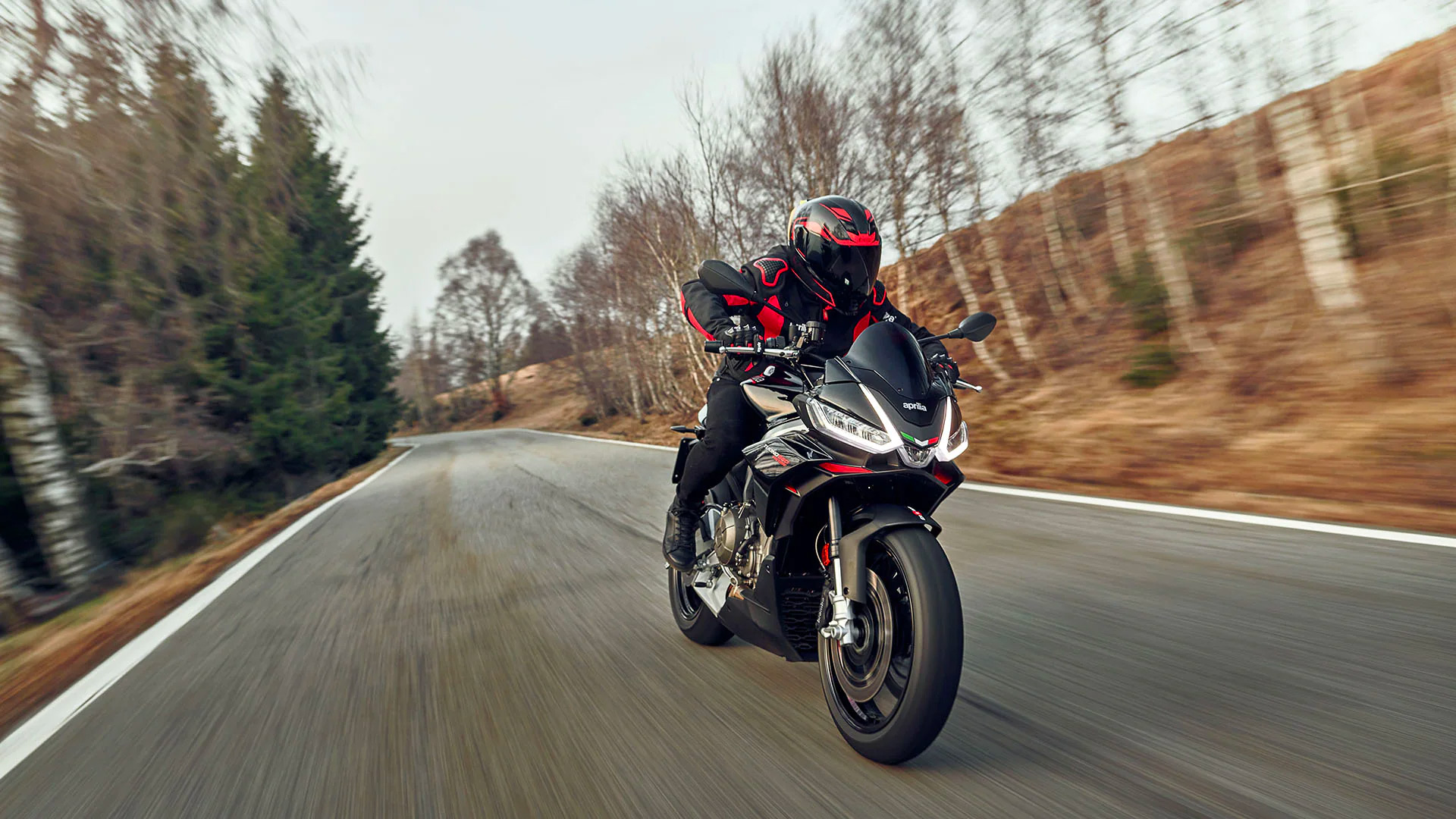 A 2023 Aprilia Tuono 660 Factory on a road in Italy