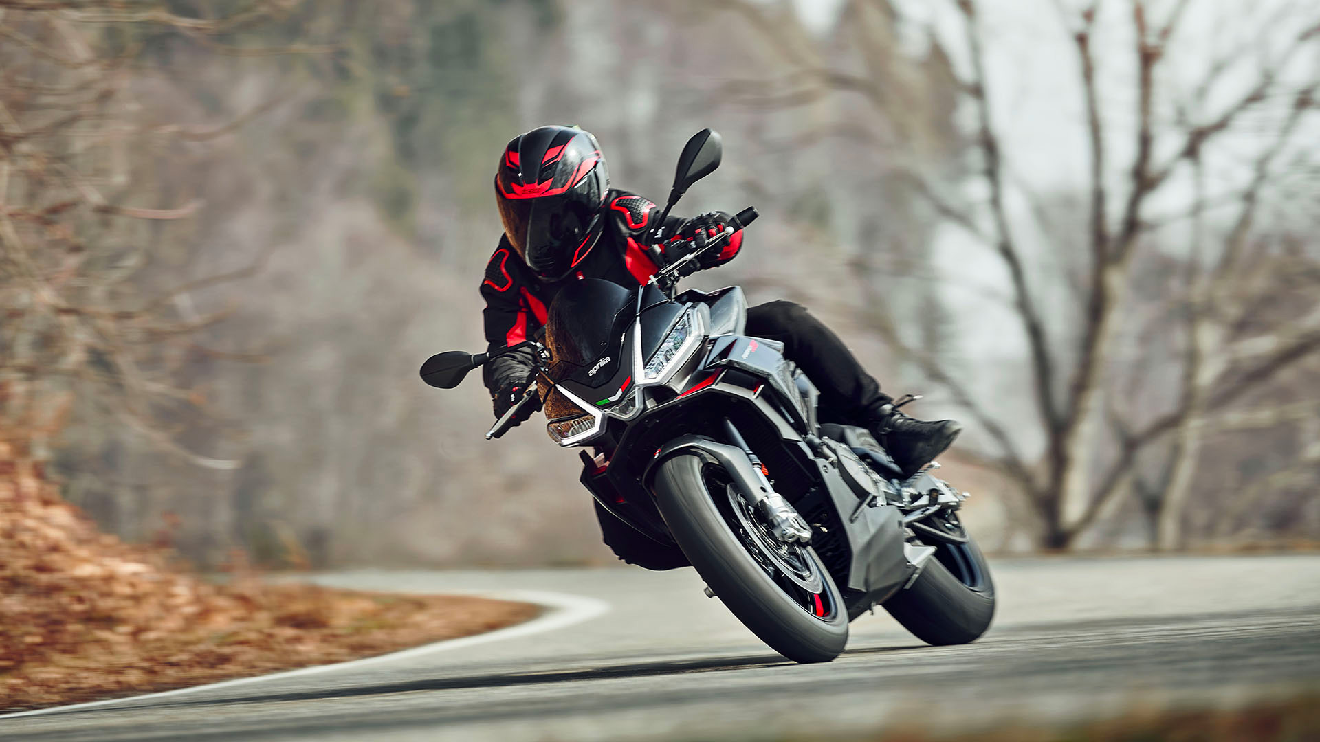 A 2023 Aprilia Tuono 660 Factory on a road in Italy