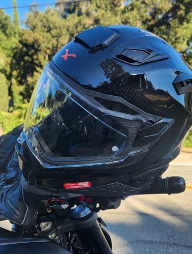 Nexx X.WST2 Carbon Helmet resting on handlebars