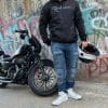 Devan wearing the REVOLT Ripped Armored Jeans in front of an Iron 883