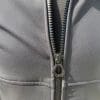 Closeup of the front zipper and large pull tab