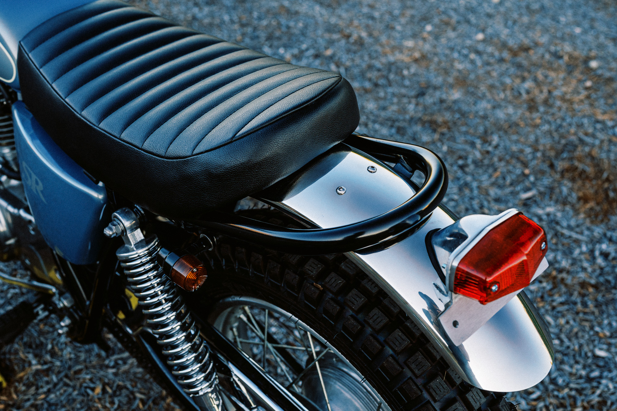 a custom Yamaha SR400 Motorcycle in Sydney at dusk in a vacant lot
