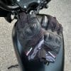 Pair of Spidi gloves resting on gas tank of bike