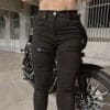 Front view of logo of the RAVEN High-Waisted REVOLT Ripped Armored Jeans