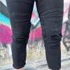 Close up of legs on the RAVEN High-Waisted REVOLT Ripped Armored Jeans