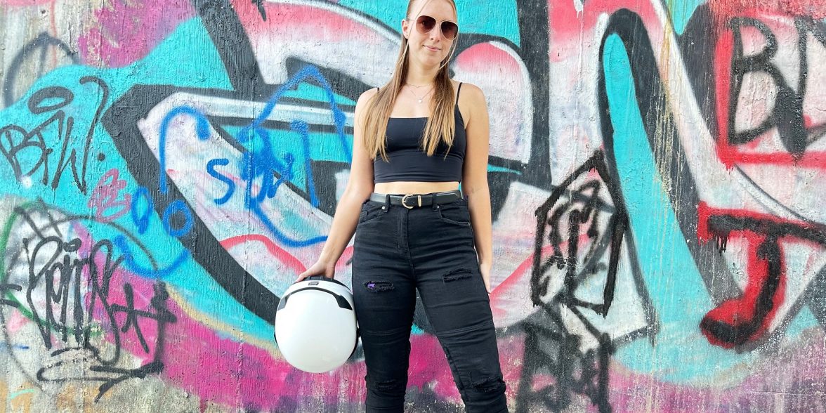 Front view of Ashley wearing the RAVEN High-Waisted REVOLT Ripped Armored Jeans