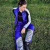 Rider sitting on the grass wearing Raven Rova Falcon Textile Pants