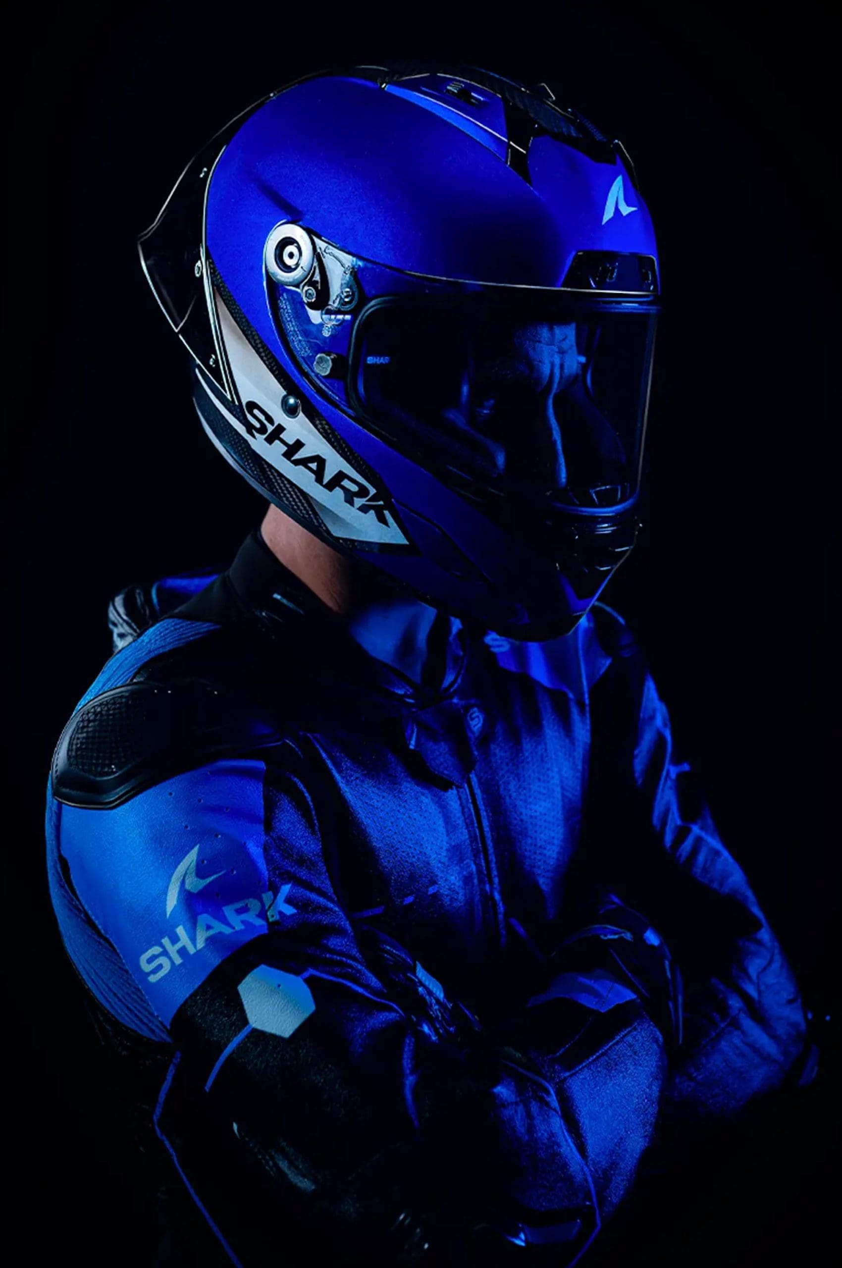 Front quarter view of a racer wearing a helmet.