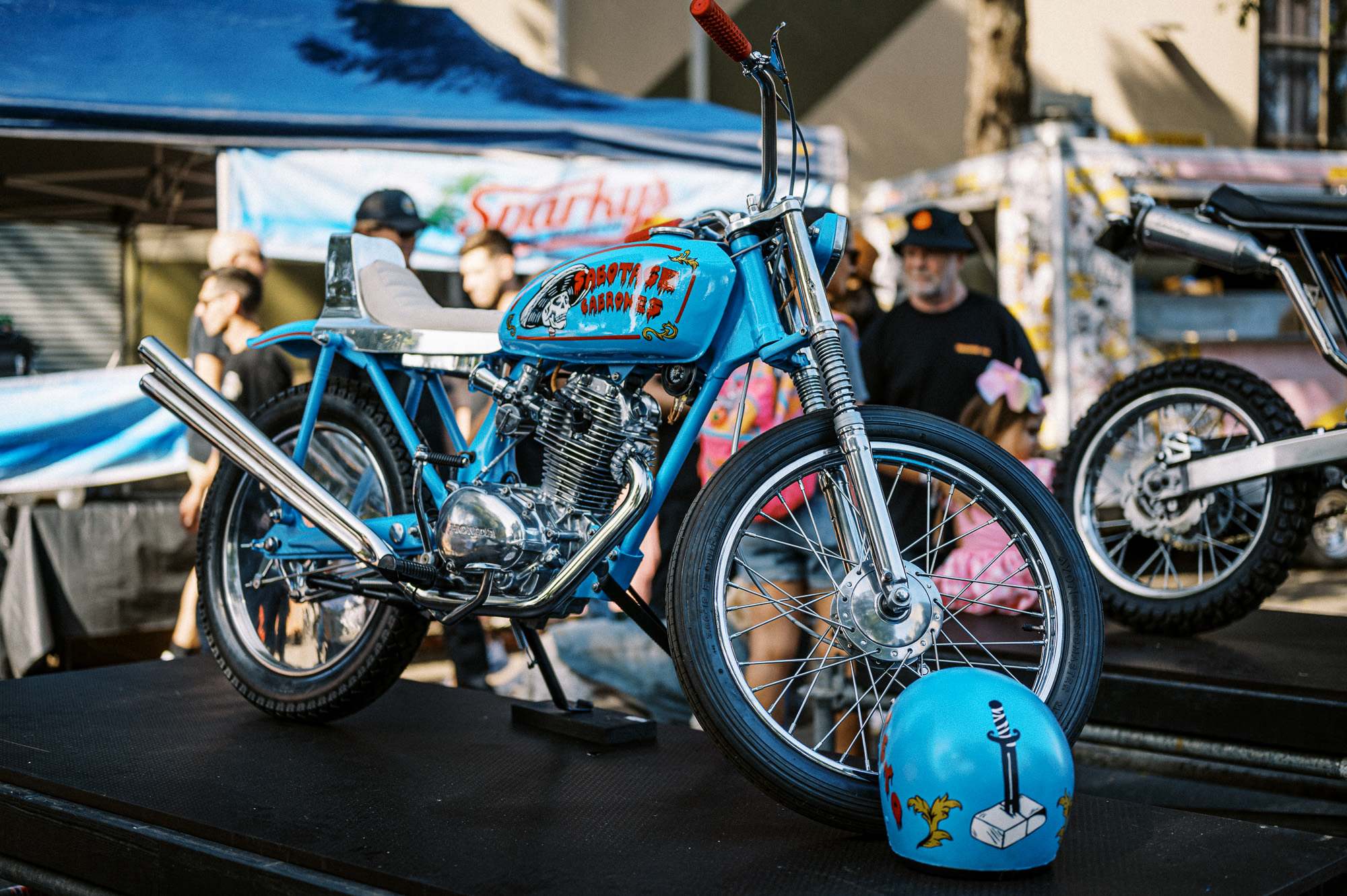 A Honda CB125 Custom on display at Sydney's 2023 Throttle Roll motorcycles show.