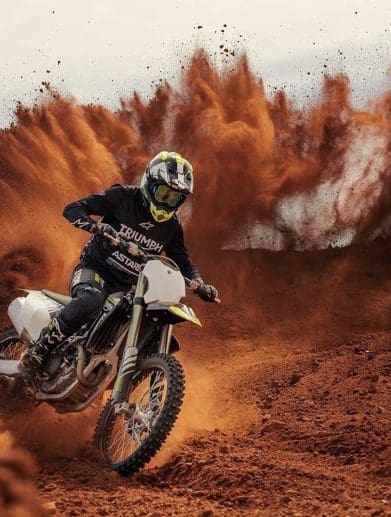 Front view of a motocross motorcycle in the desert.