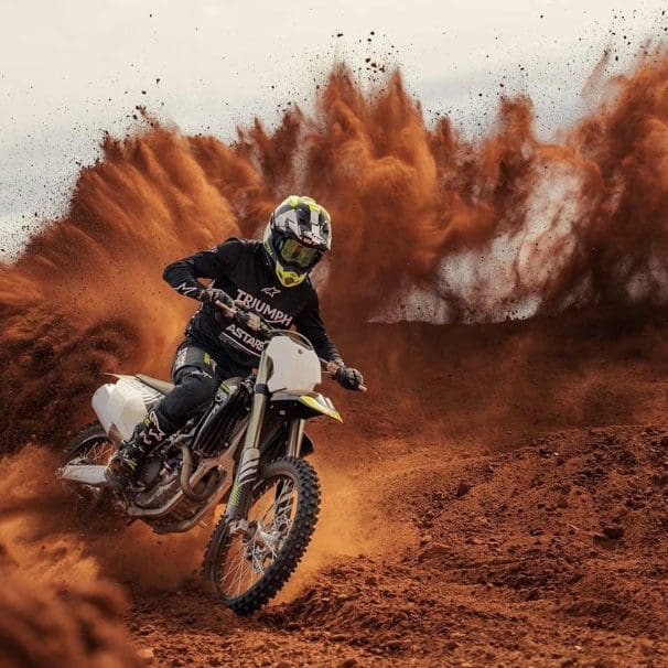 Front view of a motocross motorcycle in the desert.