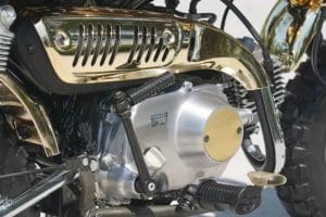 a close-up view of an exhaust on a Honda Monkey motorcycle.