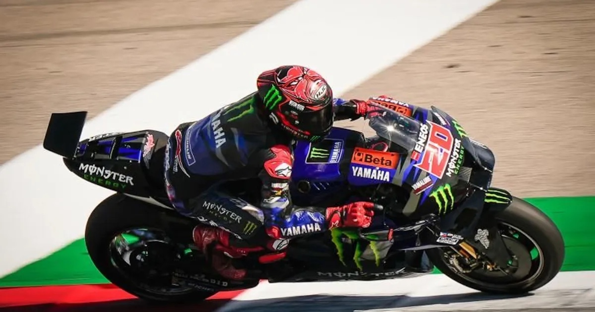 A Yamaha MotoGP bike on a circuit.