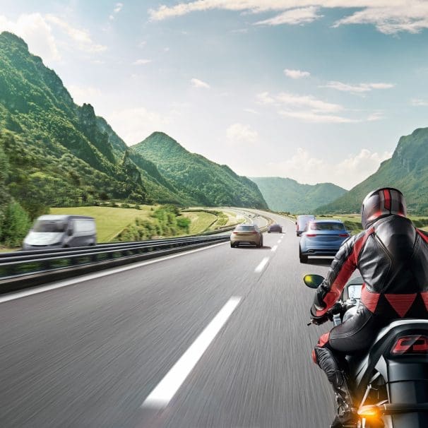 A CGI rendition of a motorcyclist on the road.