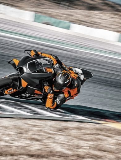 A rider on a track-focused KTM motorcycle.