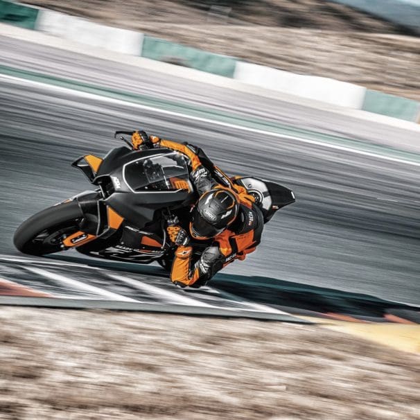 A rider on a track-focused KTM motorcycle.