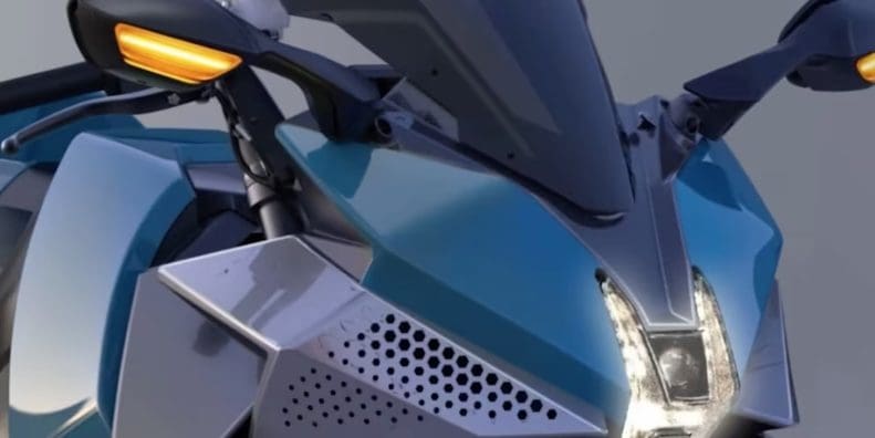 A close-up of the front headlight of a Kawasaki H2 HySE motorcycle.