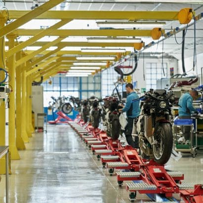 A view of a motorcycle production line in a factory.