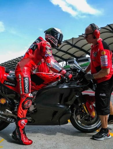 A Ducati MotoGP bike with a rider.