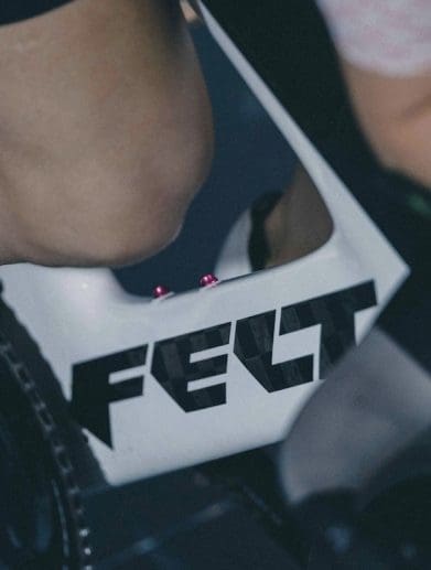 A close-up of a person on a Felt bicycle.