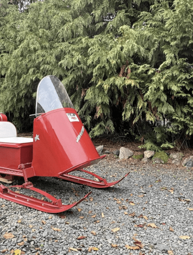 A 1964 Polaris Sno-Traveler Pacer K80D snowmobile refurbished to look like Santa's sleigh. Media provided by BringATrailer.