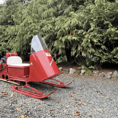 A 1964 Polaris Sno-Traveler Pacer K80D snowmobile refurbished to look like Santa's sleigh. Media provided by BringATrailer.