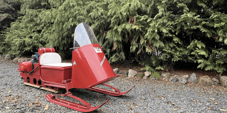 A 1964 Polaris Sno-Traveler Pacer K80D snowmobile refurbished to look like Santa's sleigh. Media provided by BringATrailer.