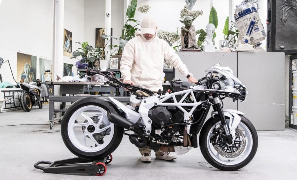 Daniel Arsham behind his Superveloce Arsham motorcycle.