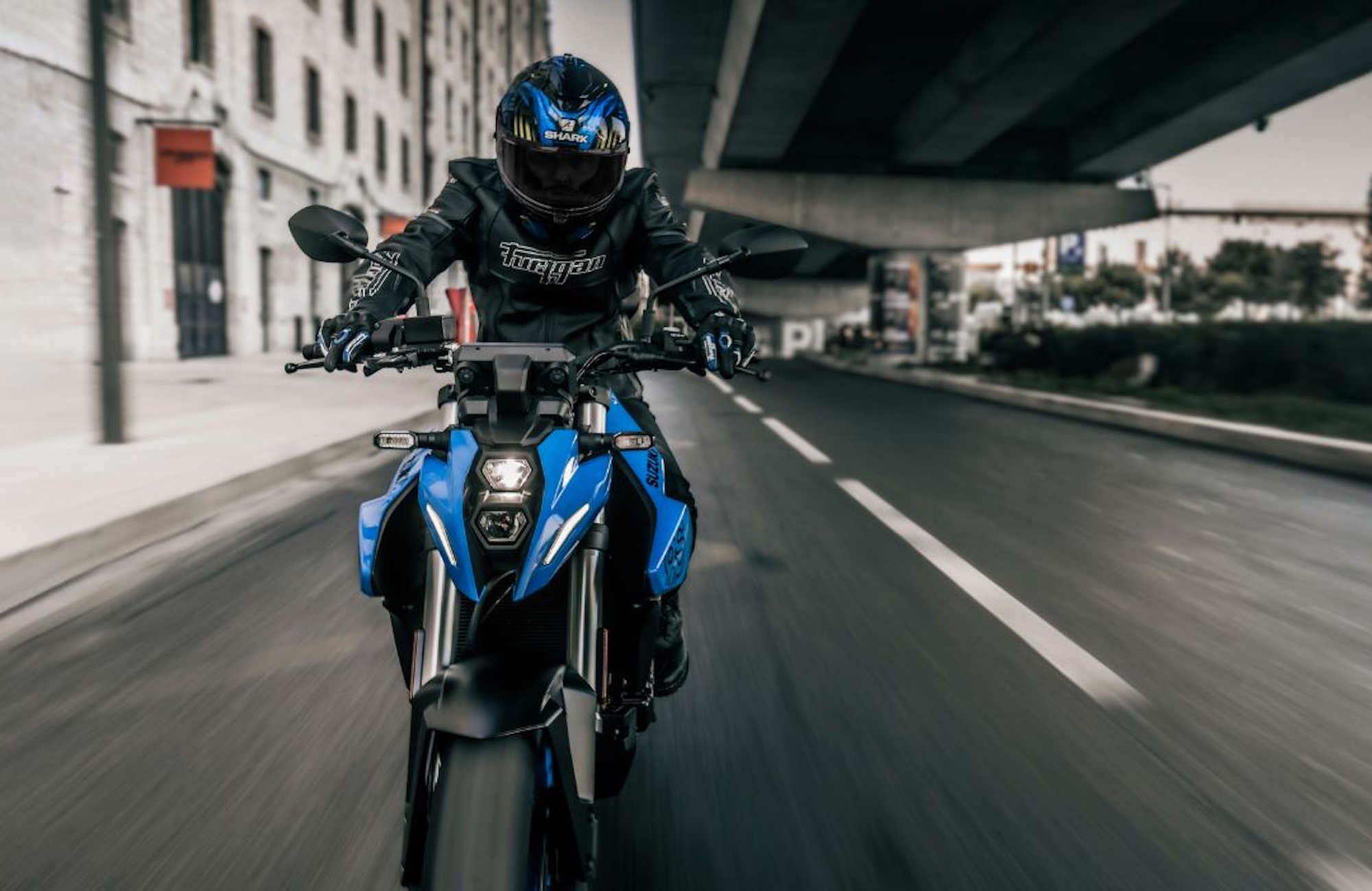 A person riding Suzuki's GSX-8s motorcycle.