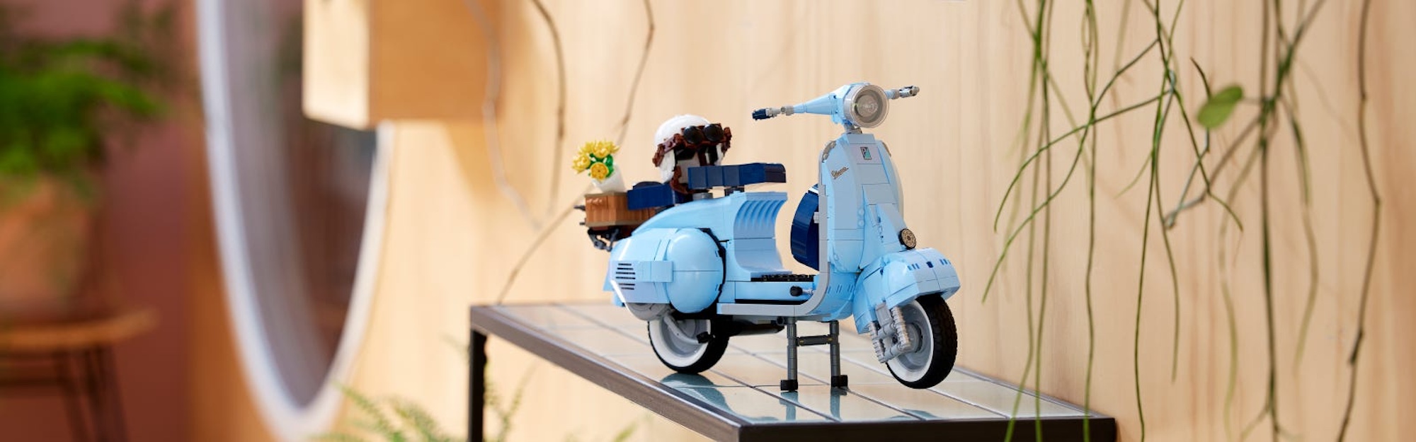 A front quarter view of a LEGO Vespa scooter.