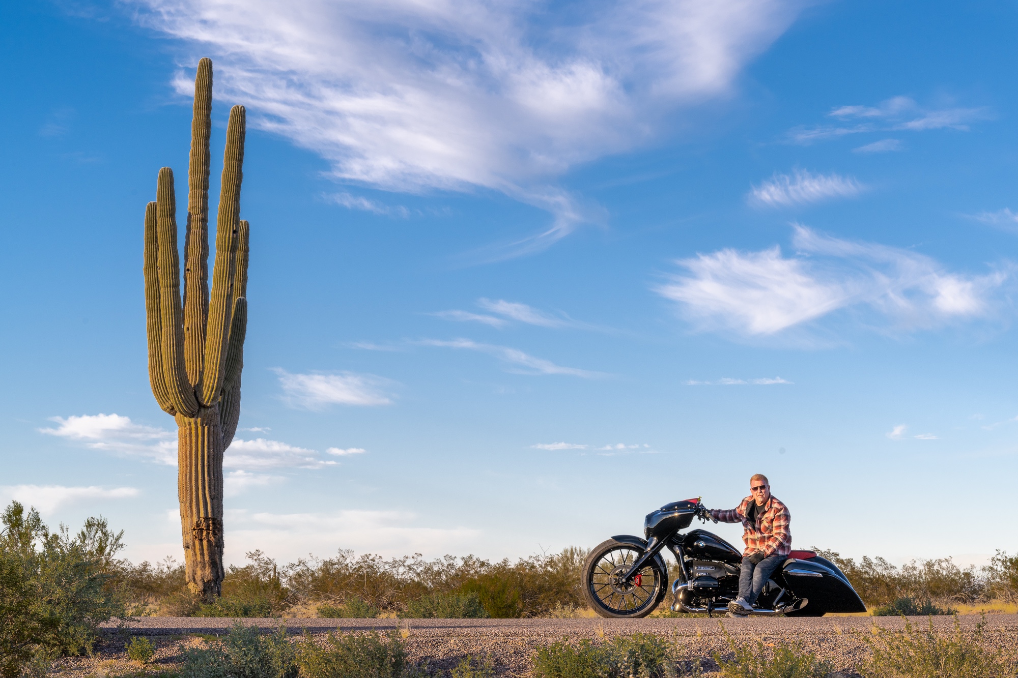 A rider on a hot rod motorcycle.