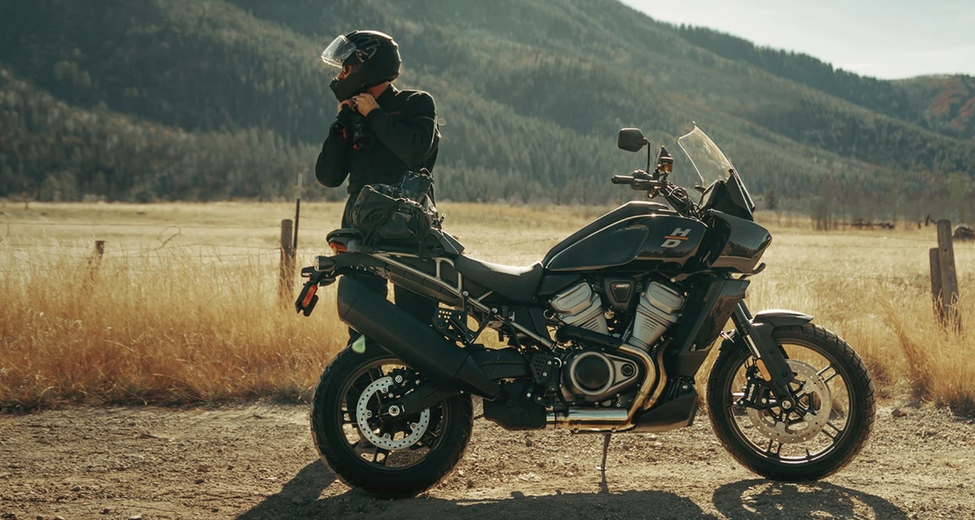 A motorcyclist getting ready to ride a Harley motorcycle.