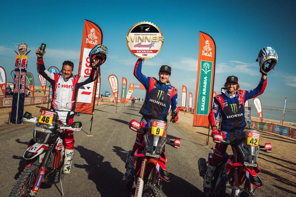 Three motorcyclists after a race.