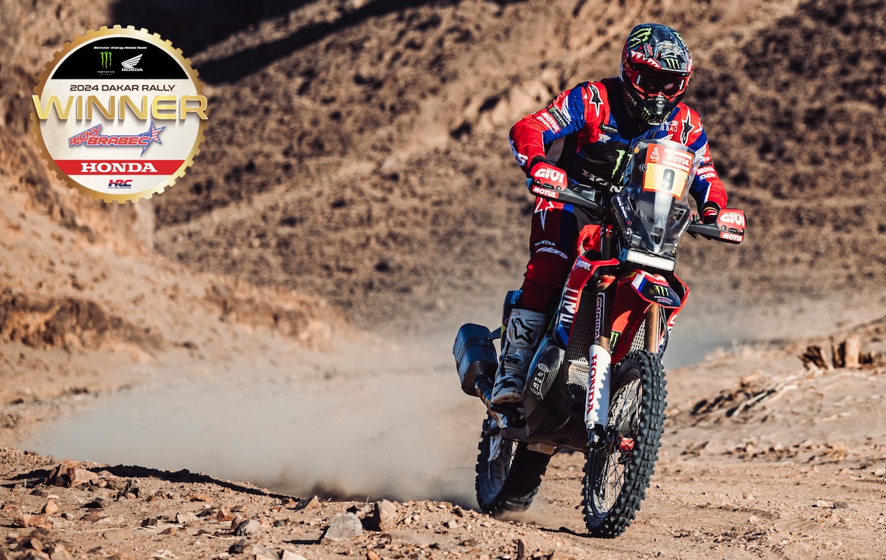 A motorcyclist riding in the desert.