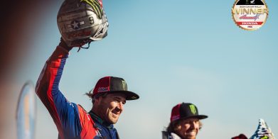 Two motorcyclists finished a race.