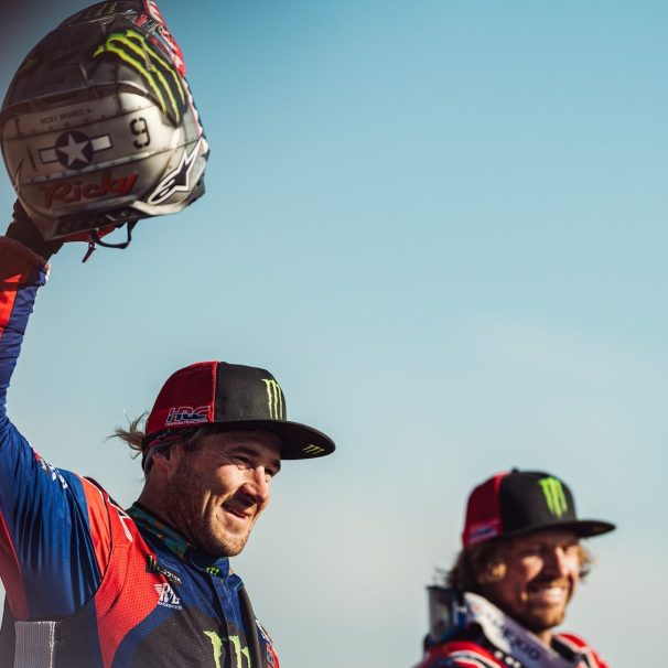 Two motorcyclists finished a race.