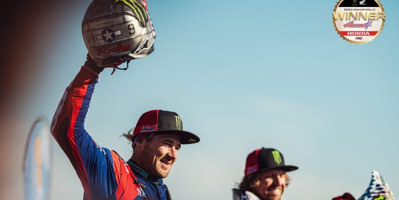 Two motorcyclists finished a race.