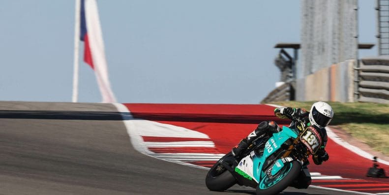 An electric superbike on a race track.