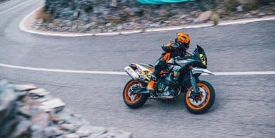 A motorcyclist riding on a road.