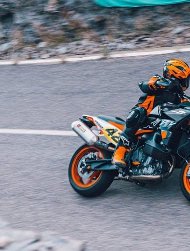 A motorcyclist riding on a road.