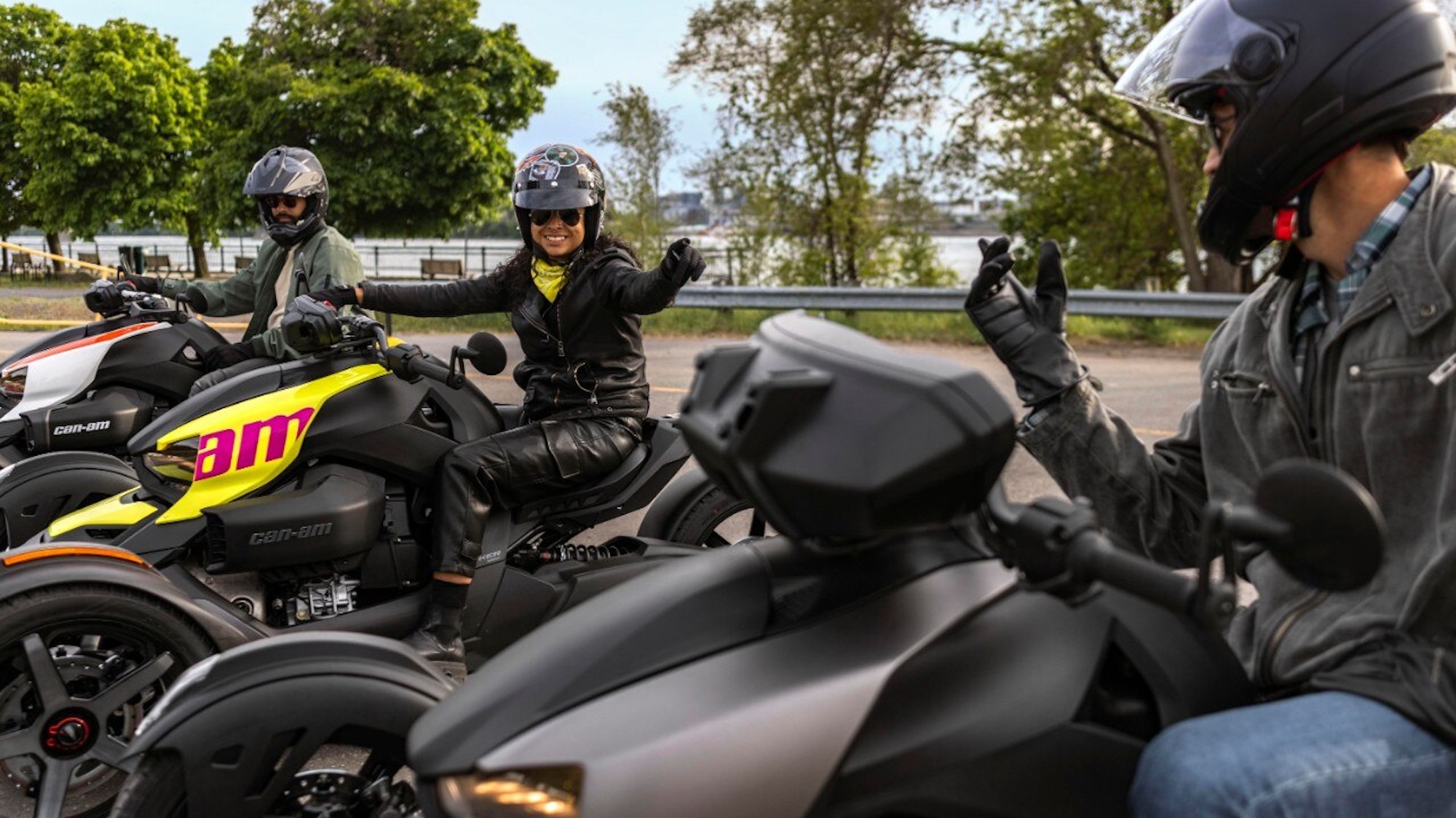 Three riders on three-wheeled motorcycles.