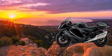 A supersport motorcycle in front of a sunset.