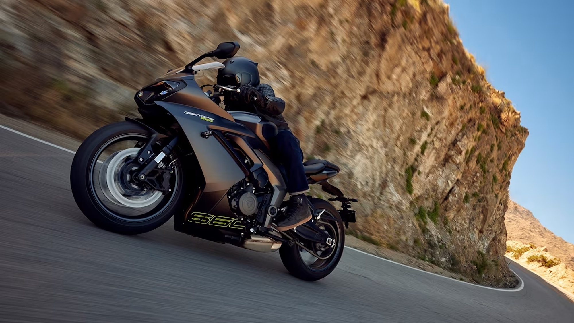 A close-up of a rider on a Triumph sport bike.