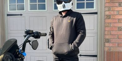 Devan wearing the Defender Motorcycle Hoodie with hands in pocket